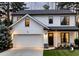 Modern two-story home with white facade, black trim, attached garage, and manicured lawn displaying 17 at 145 Silver Mine Trl, Austell, GA 30168