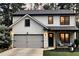 Modern farmhouse exterior with white siding, black trim, and a welcoming front porch with seating area at 145 Silver Mine Trl, Austell, GA 30168