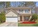 Charming two-story home with a well-maintained lawn and attached two-car garage at 145 Silver Mine Trl, Austell, GA 30168