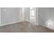 Upstairs hallway with carpet and access to various bedrooms in the home at 145 Silver Mine Trl, Austell, GA 30168