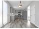 Stylish eat-in kitchen featuring stainless steel appliances and sleek gray cabinetry at 145 Silver Mine Trl, Austell, GA 30168