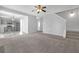 Open-concept living room with modern decor, gray walls, and staircase access at 145 Silver Mine Trl, Austell, GA 30168