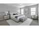 Beautiful main bedroom with natural light and ample space for furnishings at 145 Silver Mine Trl, Austell, GA 30168