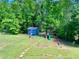 Spacious backyard with shed and playground at 148 Paradise Xing, Douglasville, GA 30134