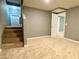 Finished basement area with stairs and a doorway to another room at 148 Paradise Xing, Douglasville, GA 30134