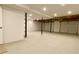 Unfinished basement area with concrete flooring and exposed ceiling with pipes and ductwork at 148 Paradise Xing, Douglasville, GA 30134