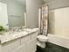 Bathroom featuring vanity with granite countertop and shower with curtain at 148 Paradise Xing, Douglasville, GA 30134