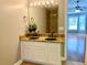 Bathroom with double sink vanity, granite countertops, and walk-in shower at 148 Paradise Xing, Douglasville, GA 30134