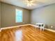Bedroom with hardwood floors, gray walls, and a window providing natural light at 148 Paradise Xing, Douglasville, GA 30134
