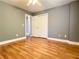 Bedroom with hardwood floors, gray walls, and closet space at 148 Paradise Xing, Douglasville, GA 30134