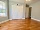 Bedroom featuring hardwood floors, closet space, and natural light at 148 Paradise Xing, Douglasville, GA 30134