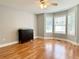 Bedroom featuring hardwood floors, gray walls, and a bay window with lots of natural light at 148 Paradise Xing, Douglasville, GA 30134