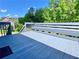 Wooden deck overlooking other houses and trees at 148 Paradise Xing, Douglasville, GA 30134