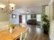 Open concept living room and dining area with wood floors and natural light at 148 Paradise Xing, Douglasville, GA 30134