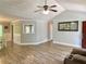 Open-concept living area featuring hardwood floors, light gray walls, and seamless flow to adjacent rooms at 148 Paradise Xing, Douglasville, GA 30134