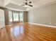 Spacious main bedroom with hardwood floors, a tray ceiling, and lots of natural light at 148 Paradise Xing, Douglasville, GA 30134