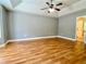 Large main bedroom with hardwood floors, tray ceiling, and ensuite bathroom at 148 Paradise Xing, Douglasville, GA 30134
