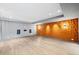 Finished basement boasts sleek flooring, an accent wall and recessed lighting at 265 Tara Trl, Atlanta, GA 30327