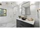 Stylish bathroom features modern fixtures, a vessel sink, and a frameless shower enclosure with detailed tile at 265 Tara Trl, Atlanta, GA 30327