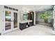 Elegant bathroom with dual vanities, marble floors, and a glass-enclosed shower at 265 Tara Trl, Atlanta, GA 30327