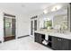 Bathroom with double vanity, marble countertop, and walk-in closet, providing ample storage at 265 Tara Trl, Atlanta, GA 30327