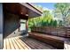 View of the exterior wood deck with built-in bench seating, perfect for outdoor relaxation at 265 Tara Trl, Atlanta, GA 30327
