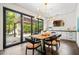 Dining area with outdoor views, stylish chandelier and access to the patio at 265 Tara Trl, Atlanta, GA 30327