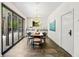 Bright dining area with modern chandelier and sliding glass doors to the patio at 265 Tara Trl, Atlanta, GA 30327