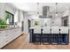 Open kitchen design with stainless appliances, island with seating, and hardwood floors at 265 Tara Trl, Atlanta, GA 30327
