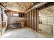 Unfinished basement area ready for storage with boxes and lawn equipment at 2871 Trailing Ivy Way, Buford, GA 30519