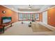 Spacious in-home gym with several windows and a ceiling fan at 2871 Trailing Ivy Way, Buford, GA 30519