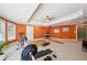 Spacious in-home gym with exercise equipment and orange walls at 2871 Trailing Ivy Way, Buford, GA 30519