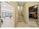 Bright hallway with stairs to the second level and entry to the gym and basement at 2871 Trailing Ivy Way, Buford, GA 30519