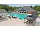 Stunning pool area with ample seating, shaded gazebos, and a spacious deck perfect for relaxation at 2871 Trailing Ivy Way, Buford, GA 30519