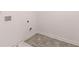 An unfinished laundry area with tile floors is ready for your washer and dryer at 641 Kimberwick Dr, Locust Grove, GA 30248