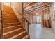Unfinished basement featuring wooden stairs and visible framing, ready for customization at 980 Windsor Place Cir, Grayson, GA 30017