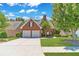 Attractive brick home with a well-maintained lawn, mature trees, and a paved driveway, offering a classic and inviting appeal at 980 Windsor Place Cir, Grayson, GA 30017