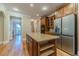 Gourmet kitchen featuring an island, stainless appliances, and custom cabinets at 980 Windsor Place Cir, Grayson, GA 30017
