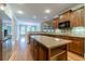 Open kitchen featuring an island, stainless appliances, and hardwood floors at 980 Windsor Place Cir, Grayson, GA 30017