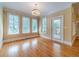 Bright living room featuring hardwood floors, and large windows offering plenty of natural light at 980 Windsor Place Cir, Grayson, GA 30017