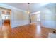 Bright living room featuring hardwood floors and decorative wall trim at 980 Windsor Place Cir, Grayson, GA 30017