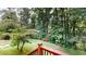 Enjoy the scenic backyard view from the wooden deck, surrounded by lush greenery at 1477 Triple Creek Nw Ct, Kennesaw, GA 30144