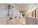 Bright bathroom features a glass enclosed shower with wood-look tile and dual shower heads at 1477 Triple Creek Nw Ct, Kennesaw, GA 30144