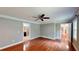 Spacious bedroom features hardwood floors, ceiling fan and multiple windows at 1477 Triple Creek Nw Ct, Kennesaw, GA 30144