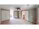 Spacious bedroom with plush carpeting, ceiling fan, and ample closet space at 1477 Triple Creek Nw Ct, Kennesaw, GA 30144