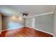 Bedroom with hardwood floors, ceiling fan, and neutral walls at 1477 Triple Creek Nw Ct, Kennesaw, GA 30144