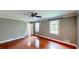 A bedroom featuring beautiful hardwood floors and natural light at 1477 Triple Creek Nw Ct, Kennesaw, GA 30144