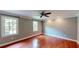 Spacious bedroom with hardwood floors and natural light from the windows at 1477 Triple Creek Nw Ct, Kennesaw, GA 30144