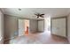 Spacious bedroom featuring neutral walls, carpeting, and a ceiling fan at 1477 Triple Creek Nw Ct, Kennesaw, GA 30144