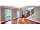 Bright foyer with hardwood floors, staircase, and stylish light fixture at 1477 Triple Creek Nw Ct, Kennesaw, GA 30144